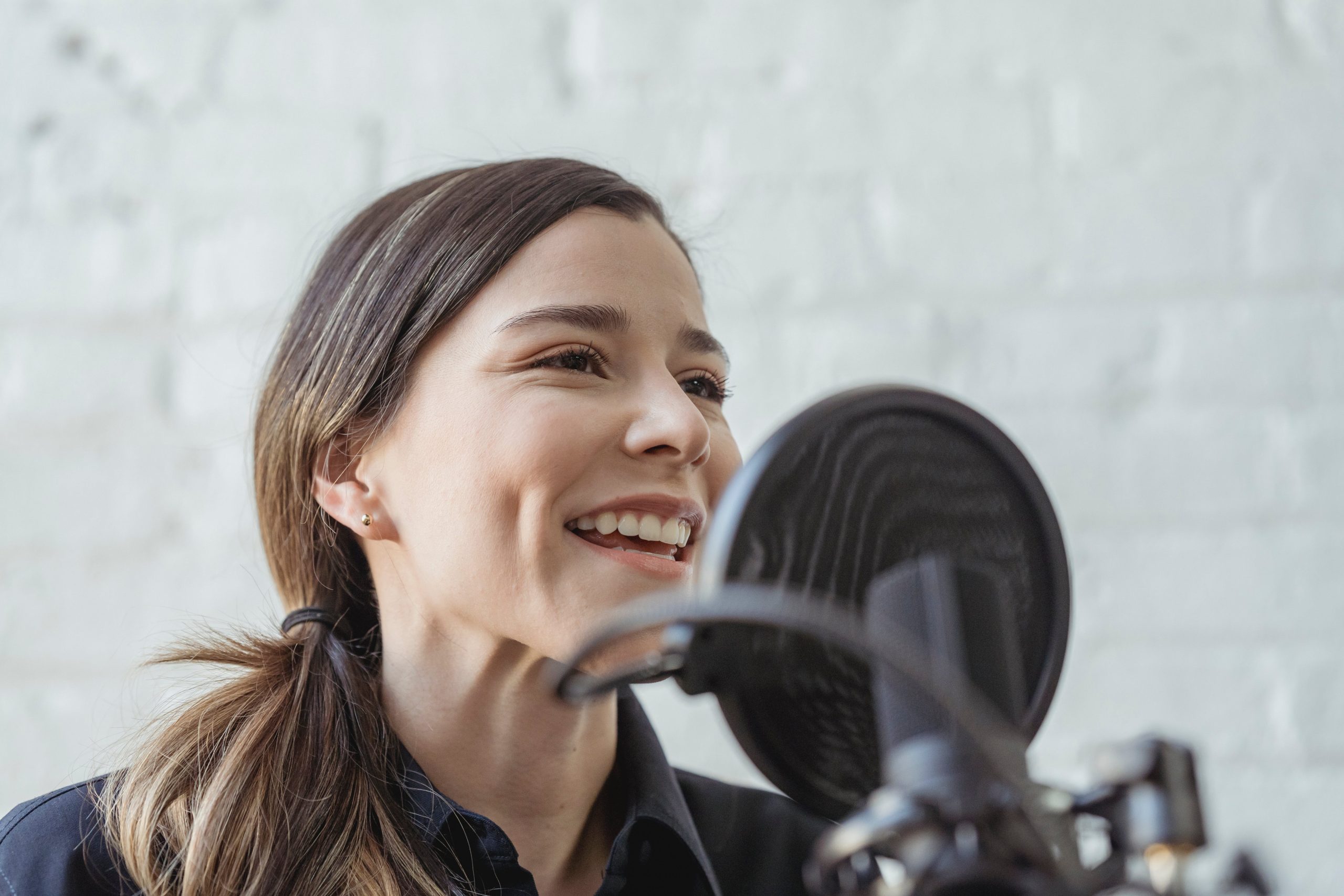 A radio presenter talks into her mic